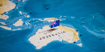 Pinned flag of Australia on map as part of crypto story about the country