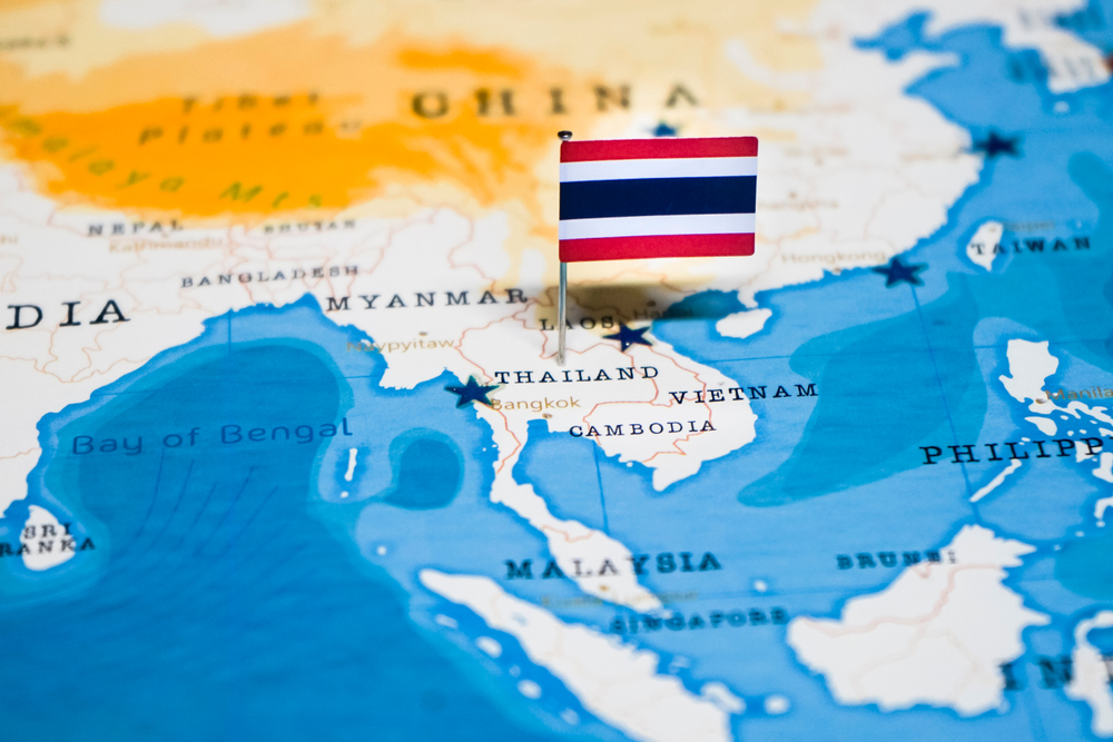 Flag marking Thailand on map of Asia.